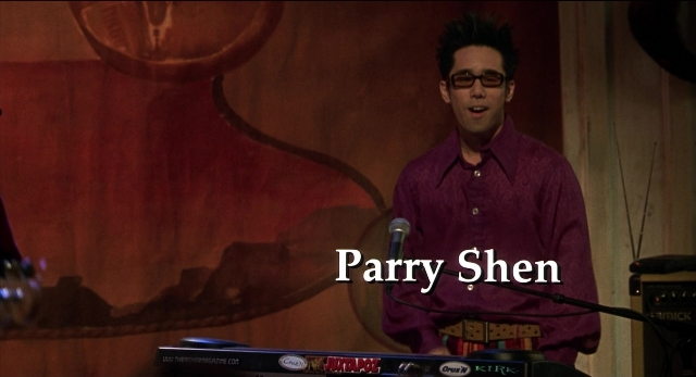 Wide shot frame from The New Guy — standing, dialogue, shirt