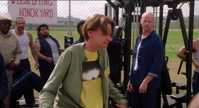 Wide shot frame from The New Guy — standing, walking, hat