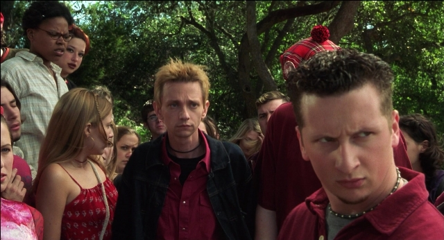 Wide shot frame from The New Guy — standing, dress, shirt