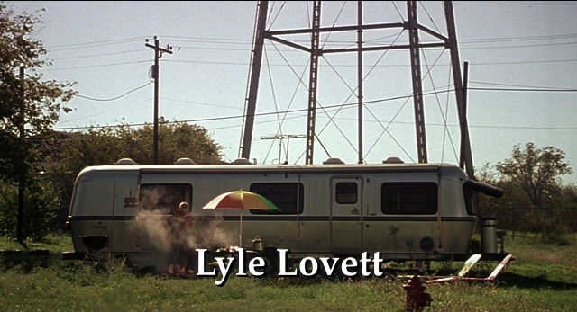Frame from The New Guy — sitting, fire, umbrella