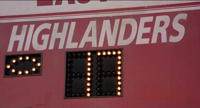 Wide shot frame from The New Guy — poster, window