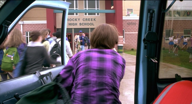 Frame from The New Guy — walking, door, street