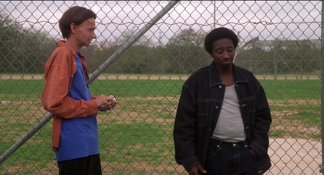 Wide shot frame from The New Guy — standing, hand, shirt