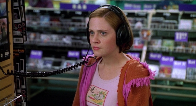 Wide shot frame from The New Guy — standing, phone, face