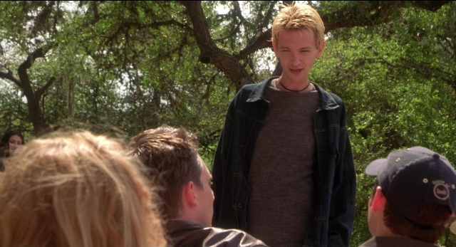Wide shot frame from The New Guy — standing, shirt, face