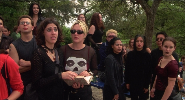 Wide shot frame from The New Guy — book, standing, dialogue
