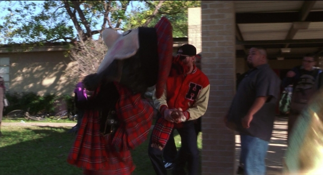 Wide shot frame from The New Guy — standing, dialogue, hat