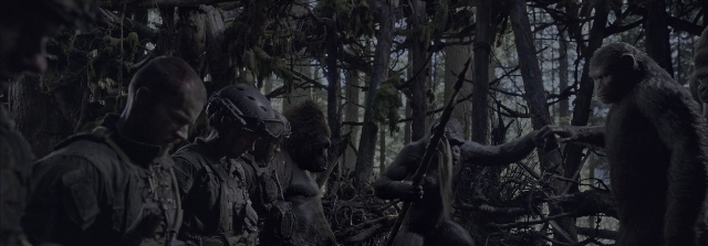 Wide shot frame from War for the Planet of the Apes — standing, dialogue, hat