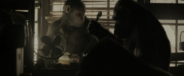 Wide shot frame from War for the Planet of the Apes — sitting, room, monkey