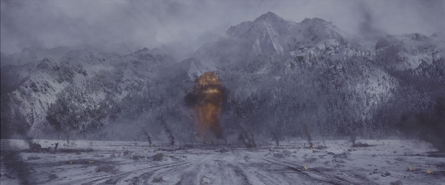 Wide shot frame from War for the Planet of the Apes — fire, smoke, snow