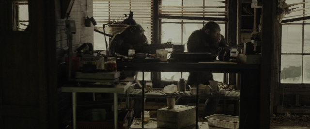 Wide shot frame from War for the Planet of the Apes — sitting, room, monkey