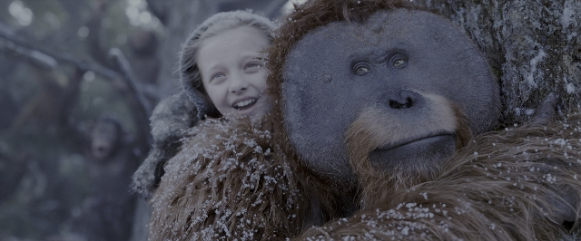 Wide shot frame from War for the Planet of the Apes — monkey, hat, hug