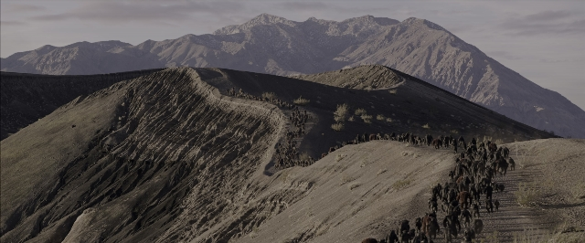 Wide shot frame from War for the Planet of the Apes — walking, animal, snow