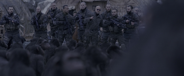 Wide shot frame from War for the Planet of the Apes — standing, person, human face