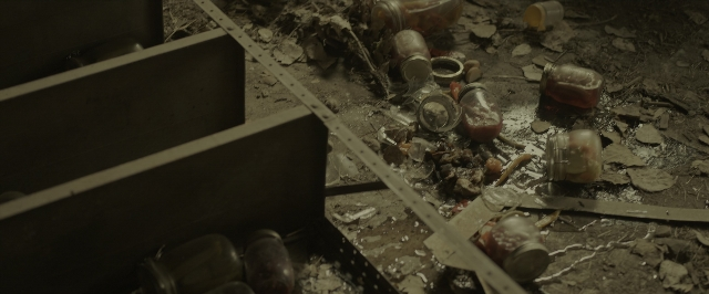 Wide shot frame from War for the Planet of the Apes — room, glass, footwear