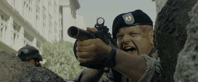 Medium shot frame from Transformers — standing, hat, uniform