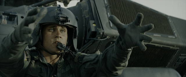 Wide shot frame from Transformers — standing, hat, uniform