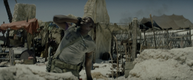 Wide shot frame from Transformers — standing, shirt, person