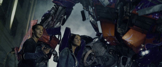 Wide shot frame from Transformers — standing, person, human face