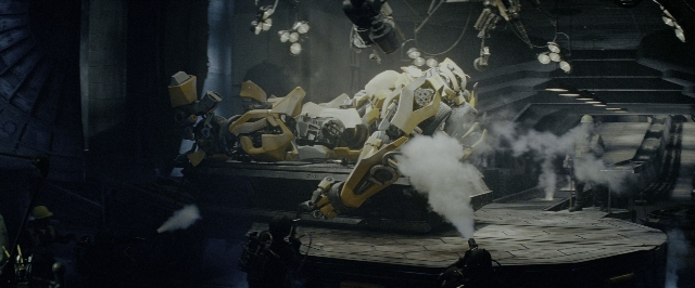 Wide shot frame from Transformers — standing, room, car