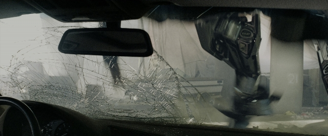 Wide shot frame from Transformers — street, car, glass
