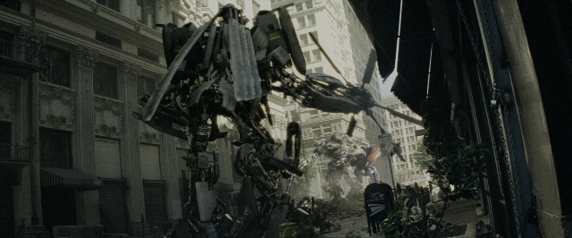 Medium shot frame from Transformers — standing, walking, street