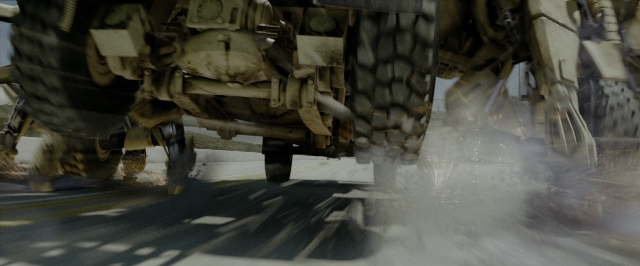 Wide shot frame from Transformers — car, wheel, land vehicle