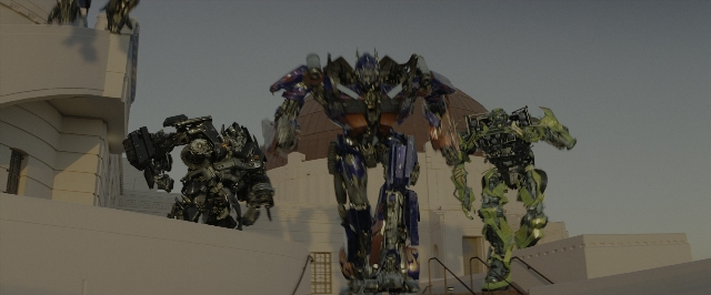 Wide shot frame from Transformers — standing, building, statue sculpture