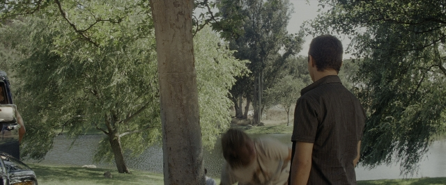 Wide shot frame from Transformers — standing, shirt, water