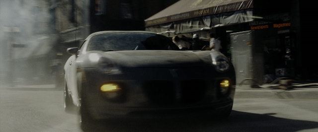 Frame from Transformers — street, car, smoke
