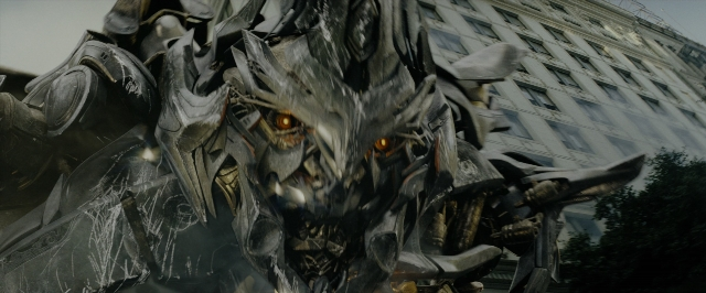 Wide shot frame from Transformers — face, statue sculpture