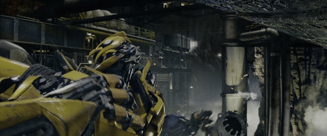 Wide shot frame from Transformers — standing, hat, smoke