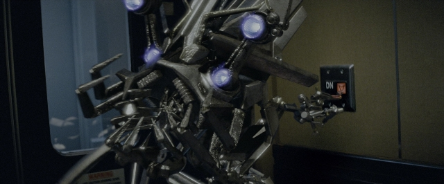 Wide shot frame from Transformers — standing, face, person