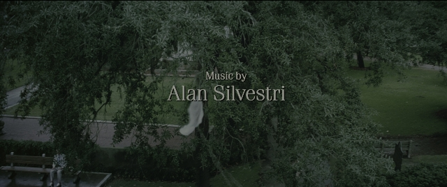 Wide shot frame from Forrest Gump — walking, bench, person
