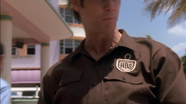 Frame from Ace Ventura: Pet Detective — standing, shirt, face