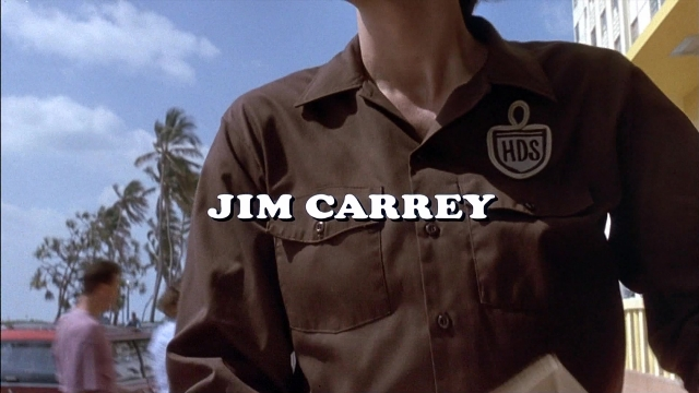 Wide shot frame from Ace Ventura: Pet Detective — standing, shirt, person