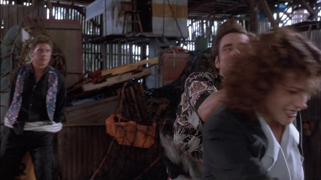 Wide shot frame from Ace Ventura: Pet Detective — standing, dialogue, shirt