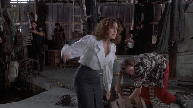 Wide shot frame from Ace Ventura: Pet Detective — standing, shirt, face
