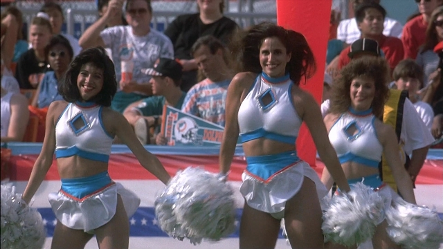 Wide shot frame from Ace Ventura: Pet Detective — person, human face, smiling
