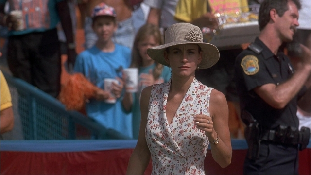 Wide shot frame from Ace Ventura: Pet Detective — standing, hat, uniform