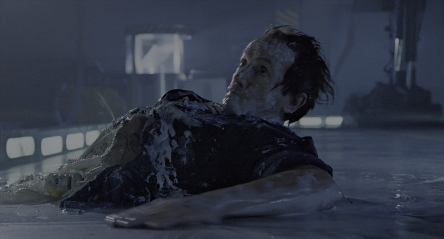 Wide shot frame from Aliens — room, water, smoke