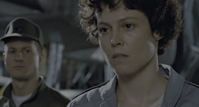 Medium shot frame from Aliens — hat, shirt, face