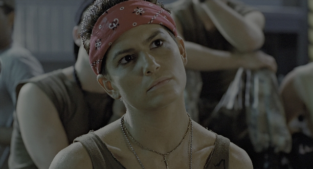 Wide shot frame from Aliens — face, hair, person