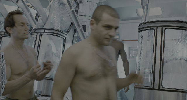 Wide shot frame from Aliens — standing, room, hand