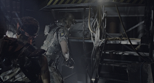 Wide shot frame from Aliens — room, dialogue, hat