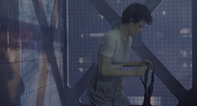Wide shot frame from Aliens — standing, shirt, face