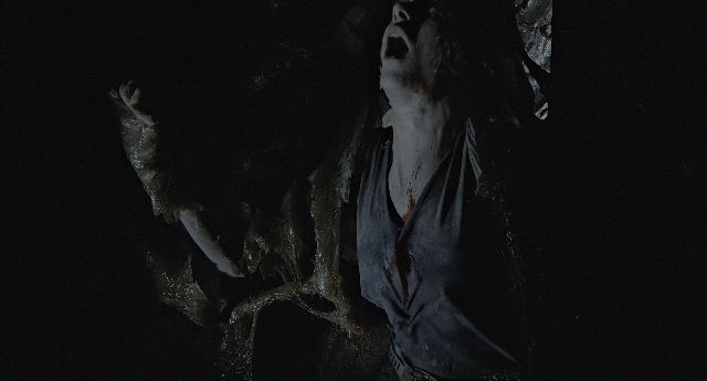 Wide shot frame from Aliens — standing, shirt, water