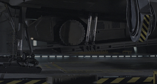 Wide shot frame from Aliens — night, airplane, wheel