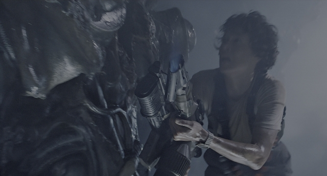 Wide shot frame from Aliens — standing, hand, shirt