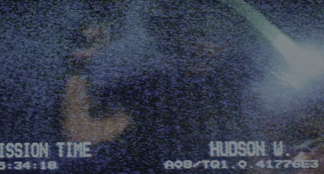 Frame from Aliens — water, poster, airplane